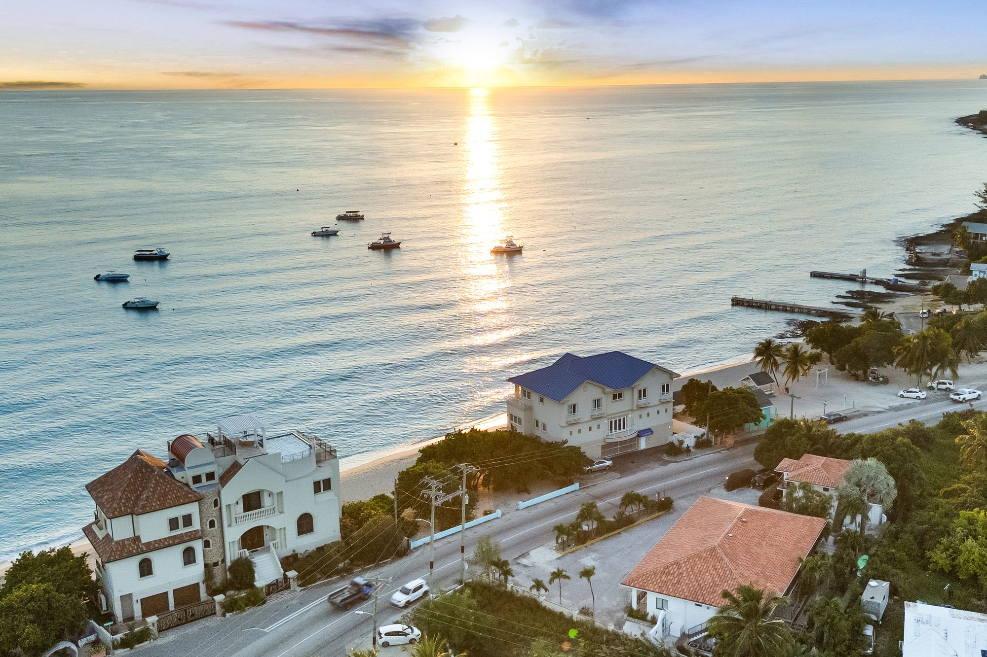 Sunset over West Bay, from the air above Calypso Cove