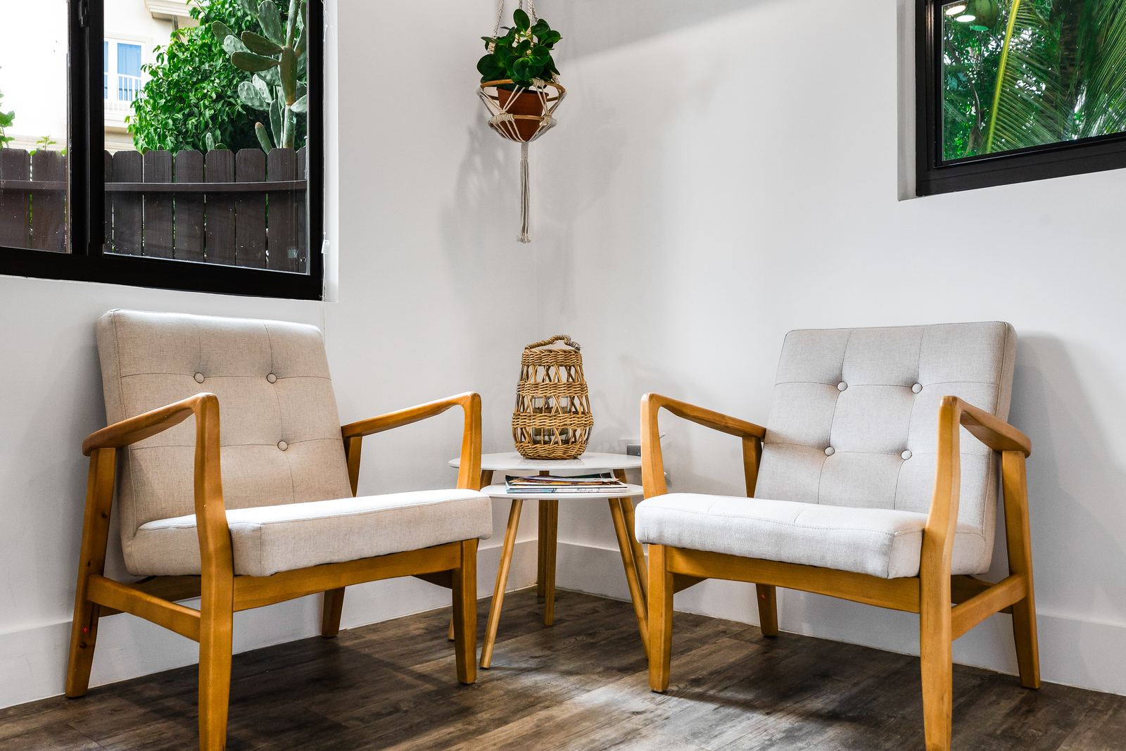 Two reading chairs by the window — Calypso Cove 1, Palm Bay Getaways, Grand Cayman